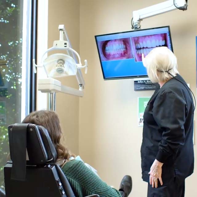 comprehensive exam showing teeth to patient