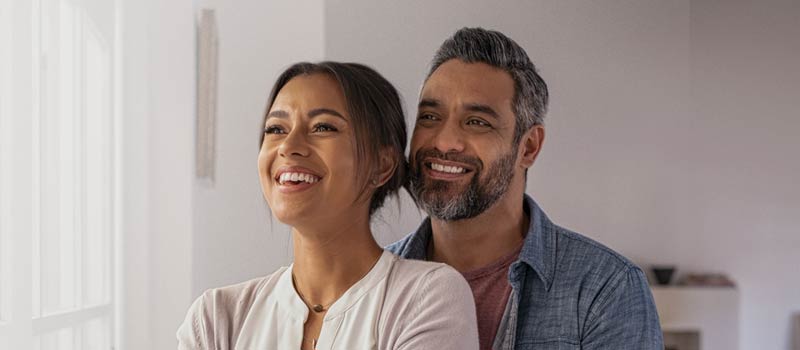 hero image of couple smiling mobile size